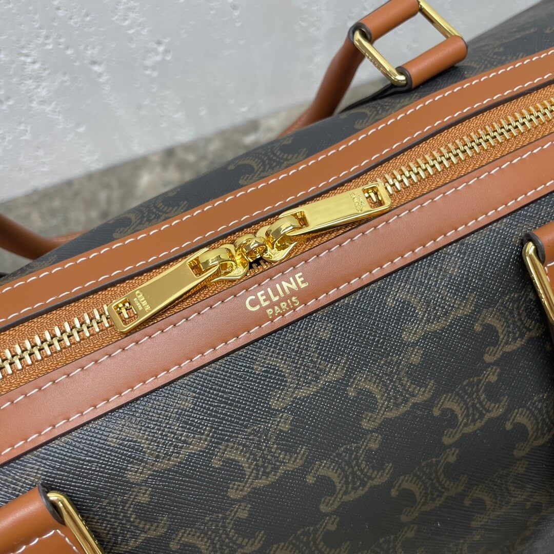 Ce**e medium duffle bag in logo-print calfskin